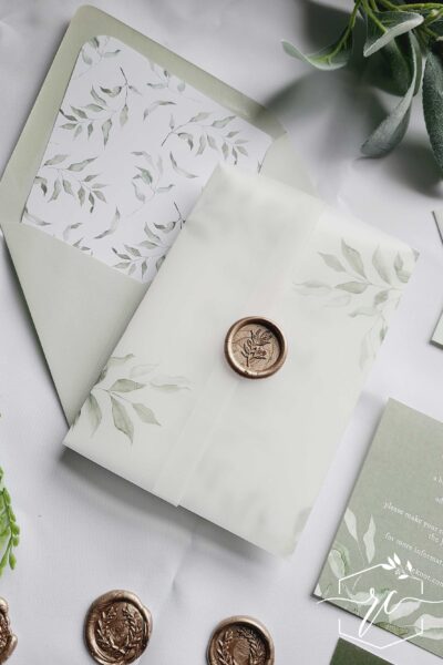 The ava Wedding Invitation collection features soft sage greenery branches and shades of muted green for a layered fresh look