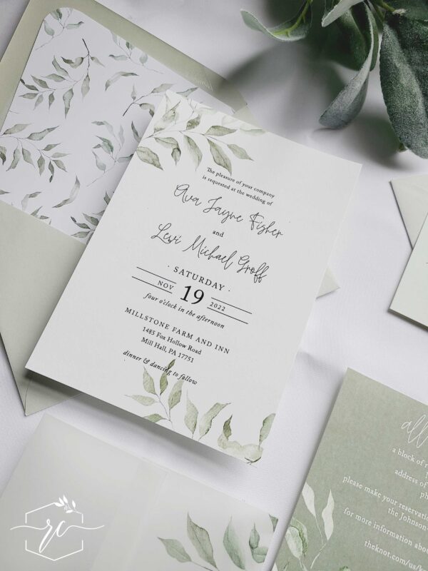 The Eva Wedding Invitation collection features soft sage greenery branches and shades of muted green for a layered fresh look