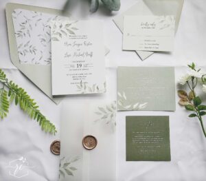The Ava Wedding Invitation collection features soft sage greenery branches and shades of muted green for a layered fresh look