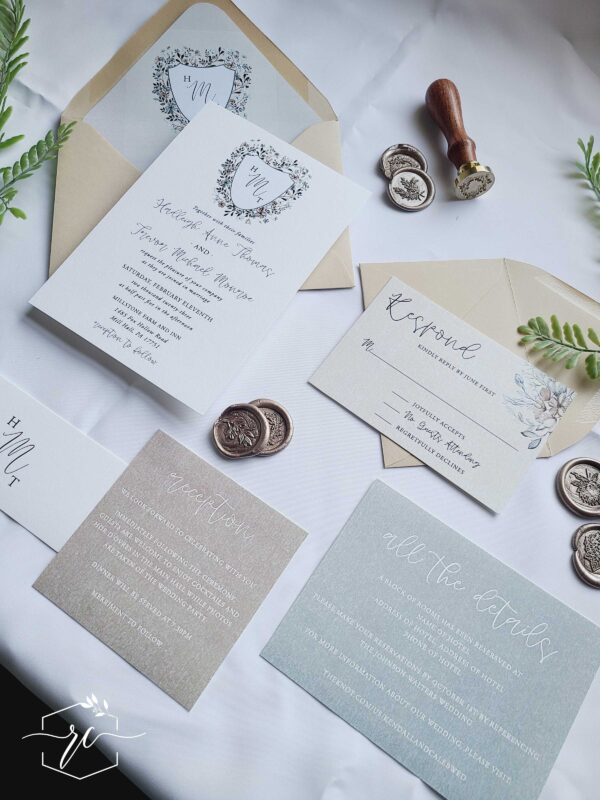 felicia wedding invitation with woodsy monogram crest