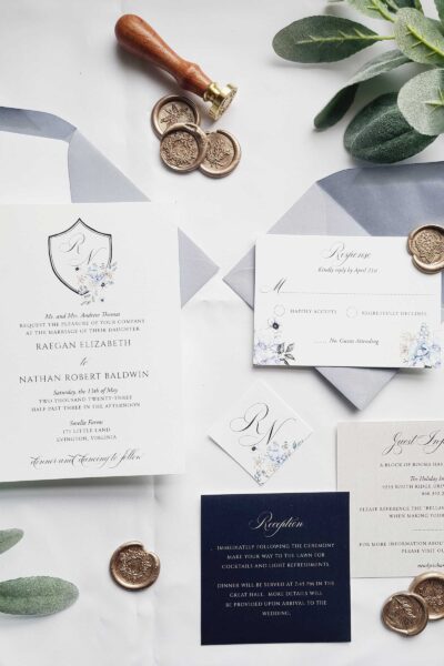 the raegan wedding invitation suite - dusty blue floral monogram crest