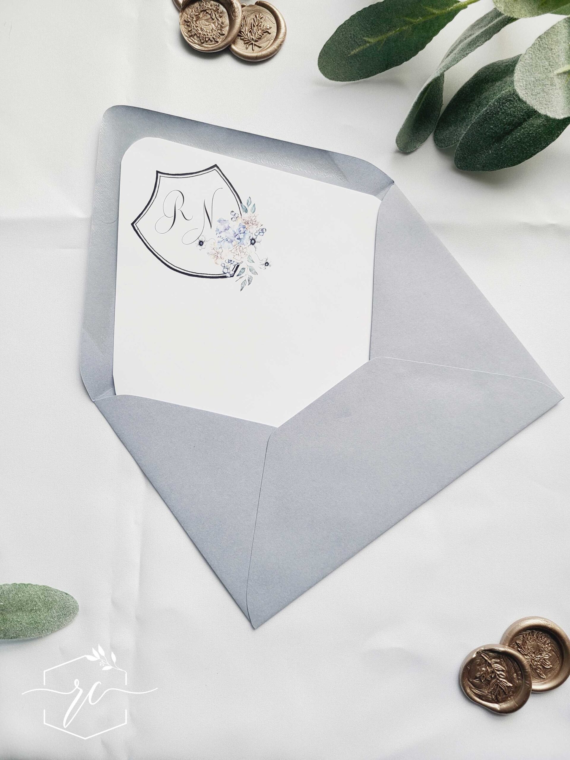 the raegan wedding invitation suite - dusty blue floral monogram crest