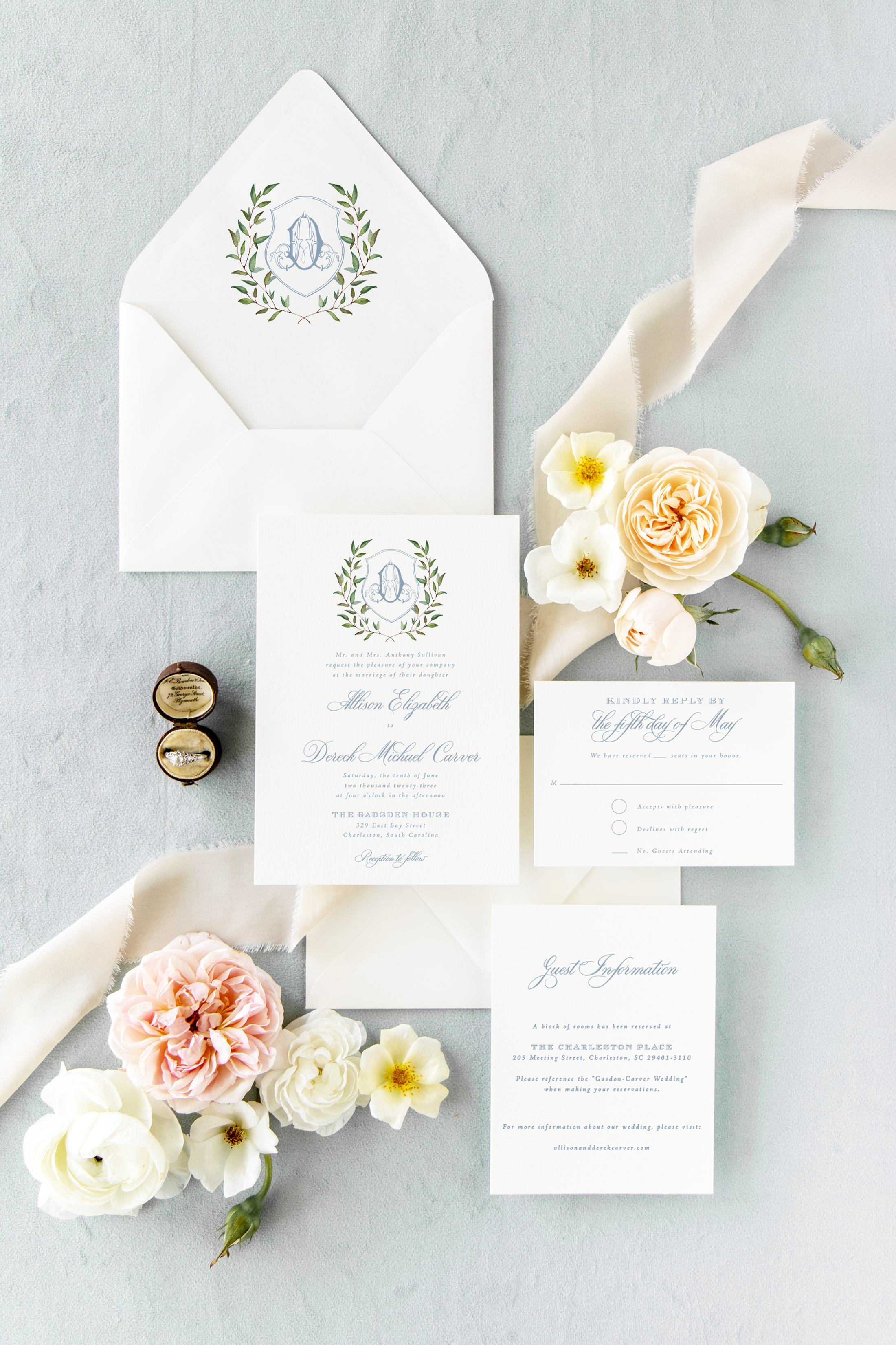 the sibyl dusty blue monogram crest wedding invitation suite