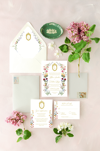 the lillian wedding invitation with crest and wildflowers