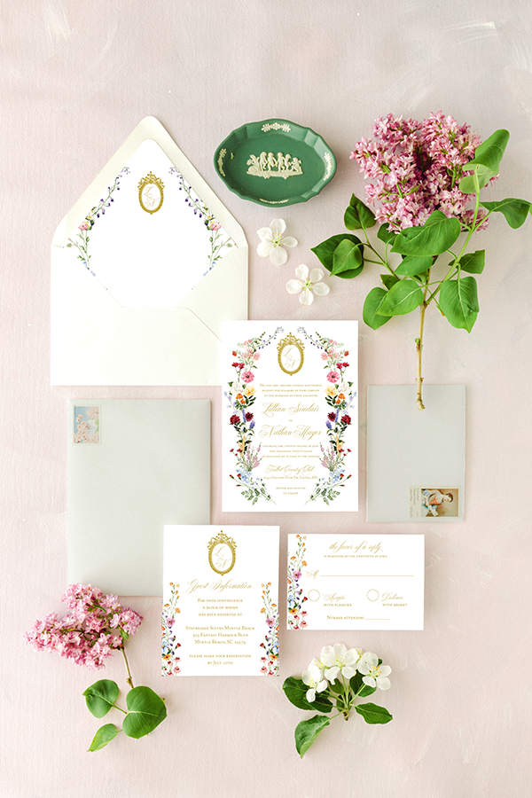the lillian wedding invitation with crest and wildflowers
